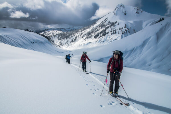 Skiing onto the Neve with the Gargoyles and Ring Creek in the background